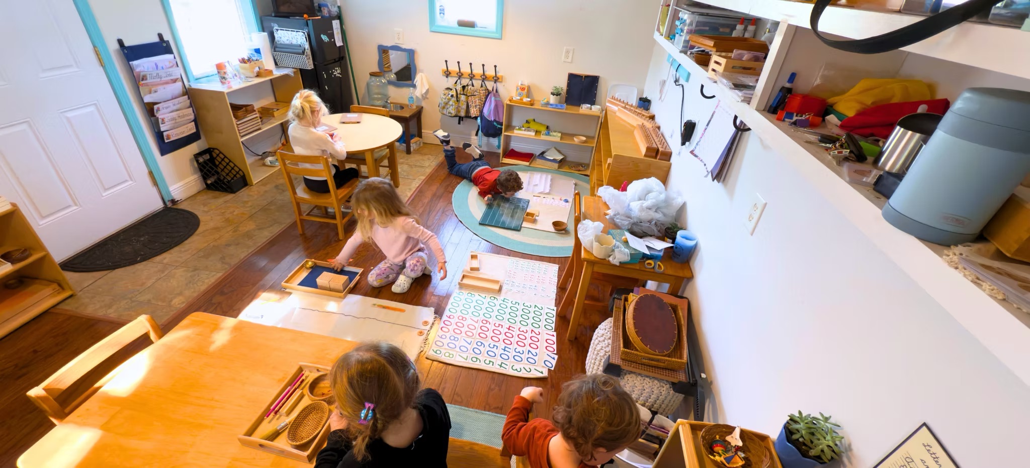Children learning indoors at SoundSide Montessori Academy